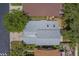 Aerial view of a single-Gathering home showing the roof and surrounding trees at 1830 Springwood N Cir, Clearwater, FL 33763