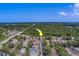 Aerial view of neighborhood with arrow showing the location of a house at 1830 Springwood N Cir, Clearwater, FL 33763