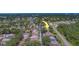 Aerial view of neighborhood with arrow showing the location of a house near the highway at 1830 Springwood N Cir, Clearwater, FL 33763