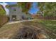 A spacious backyard offers a patio area, lush lawn, and a wooden fence, perfect for outdoor enjoyment at 1830 Springwood N Cir, Clearwater, FL 33763