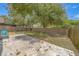 This fenced backyard offers a travertine patio area and well-maintained perimeter fence for relaxation at 1830 Springwood N Cir, Clearwater, FL 33763