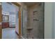 Bathroom featuring tiled shower with glass door, vanity, and soaking tub at 1830 Springwood N Cir, Clearwater, FL 33763