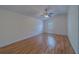 Bedroom features ceiling fan, vaulted ceilings and wood-look floors at 1830 Springwood N Cir, Clearwater, FL 33763