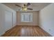 Bedroom with a ceiling fan, laminate wood flooring, closet and a bay window at 1830 Springwood N Cir, Clearwater, FL 33763