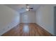 Bright bedroom with a ceiling fan and wood-look flooring at 1830 Springwood N Cir, Clearwater, FL 33763
