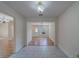 Dining room features tiled floor, stylish lighting, and leads to living area with attractive hardwood flooring at 1830 Springwood N Cir, Clearwater, FL 33763