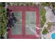Aerial view of tennis courts with basketball court feature and nearby pool at 1830 Springwood N Cir, Clearwater, FL 33763