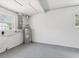 Clean basement area featuring a water heater and ample space for storage at 1843 Berg Rd, Holiday, FL 34690