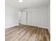 Cozy bedroom with wood floors, a large closet and good natural light at 1843 Berg Rd, Holiday, FL 34690