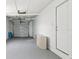 Spacious garage area with a door leading to the outside and ample space for storage at 1843 Berg Rd, Holiday, FL 34690