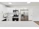 Modern kitchen with stainless steel appliances, quartz countertops, and white subway tile backsplash at 1843 Berg Rd, Holiday, FL 34690