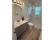 Modern bathroom with glass enclosed shower, updated vanity, and contemporary finishes at 1913 W Saint Conrad St, Tampa, FL 33607