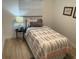 Inviting bedroom with a twin bed, stylish bedding, and ample natural light at 1913 W Saint Conrad St, Tampa, FL 33607
