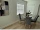 Cozy dining area with modern table, chairs, and plenty of natural light at 1913 W Saint Conrad St, Tampa, FL 33607