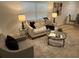 Comfortable living room with modern furniture, neutral tones, and ample natural light at 1913 W Saint Conrad St, Tampa, FL 33607