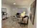 Cozy living room with stylish seating, modern accents, and wood-look flooring at 1913 W Saint Conrad St, Tampa, FL 33607