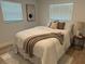 Comfortable bedroom with soft lighting, wood-look flooring, and neutral decor at 1913 W Saint Conrad St, Tampa, FL 33607