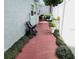 Charming outdoor patio area with a brick-tiled walkway, leading to lush greenery at 1918 Crown Park Dr, Valrico, FL 33594