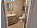 Tiled bathroom featuring a modern vanity, toilet, and enclosed shower at 1918 Crown Park Dr, Valrico, FL 33594