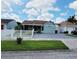 Inviting single-story home with a manicured lawn and a welcoming facade at 1918 Crown Park Dr, Valrico, FL 33594