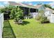 Charming single-story home with green lawn, manicured bushes and white picket fence at 1918 Crown Park Dr, Valrico, FL 33594