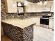 Modern kitchen with stainless steel appliances, light countertops and mosaic tile backsplash at 1918 Crown Park Dr, Valrico, FL 33594