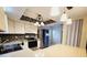 Kitchen featuring stainless steel appliances, island, and decorative lighting at 1918 Crown Park Dr, Valrico, FL 33594