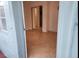 Bright living room with tiled floors, slider closet doors and access to other living spaces at 1918 Crown Park Dr, Valrico, FL 33594