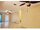 Spacious living room boasting contemporary flooring and a ceiling fan at 1918 Crown Park Dr, Valrico, FL 33594