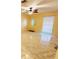 Cozy living room featuring contemporary flooring, ceiling fan and natural light at 1918 Crown Park Dr, Valrico, FL 33594