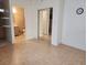 Open floor plan with tiled floors, closet and views of the ensuite bathroom at 1918 Crown Park Dr, Valrico, FL 33594