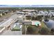 Aerial view of community clubhouse with pool, tennis courts, common areas, and surrounding landscape and neighborhood at 1921 58Th N Ave # 15, St Petersburg, FL 33714