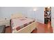 This bedroom features hardwood floors and a walk-in closet with visible personal items at 1921 58Th N Ave # 15, St Petersburg, FL 33714