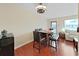 Cozy dining area with dark hardwood floors, modern table, and stylish lighting at 1921 58Th N Ave # 15, St Petersburg, FL 33714