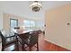 Dining area features a dark wood table with bar stools, and dark hardwood floors at 1921 58Th N Ave # 15, St Petersburg, FL 33714