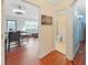 Inviting hallway view of the living room, bathroom, and hardwood flooring at 1921 58Th N Ave # 15, St Petersburg, FL 33714