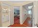Open hallway showcasing bathroom and bedroom with hardwood flooring and great lighting at 1921 58Th N Ave # 15, St Petersburg, FL 33714