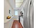 Efficient kitchen with white cabinets, stainless steel appliances, and access to the outside at 1921 58Th N Ave # 15, St Petersburg, FL 33714