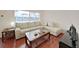 Comfortable living room with plush sofa, hardwood floors, and bright windows at 1921 58Th N Ave # 15, St Petersburg, FL 33714