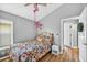 Bedroom shows ceiling fan, closet, and hard wood floors at 2527 Butterfly Landing Dr, Land O Lakes, FL 34638