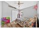 This bedroom features wood floors and a large closet at 2527 Butterfly Landing Dr, Land O Lakes, FL 34638