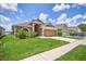 Charming home with a well-manicured lawn and a two-car garage at 2527 Butterfly Landing Dr, Land O Lakes, FL 34638