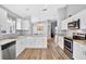 Modern kitchen featuring granite countertops, stainless steel appliances, and ample cabinet space at 2527 Butterfly Landing Dr, Land O Lakes, FL 34638