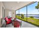 Relaxing screened-in patio with lake views and comfortable seating for outdoor enjoyment at 2527 Butterfly Landing Dr, Land O Lakes, FL 34638