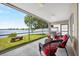 Relaxing screened-in patio with lake views and comfortable seating for outdoor enjoyment at 2527 Butterfly Landing Dr, Land O Lakes, FL 34638