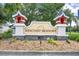 Welcoming community entrance sign for Suncoast Meadows with stone accents and decorative towers at 2527 Butterfly Landing Dr, Land O Lakes, FL 34638