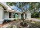 Charming one-story home featuring manicured landscaping and an attached two-car garage at 2609 Sunnyside Cir, Palm Harbor, FL 34684