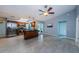 Kitchen and eating area with stainless appliances, marble countertops, and tile floors at 2609 Sunnyside Cir, Palm Harbor, FL 34684