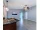 Kitchen island, light fixtures, and tile floor at 2609 Sunnyside Cir, Palm Harbor, FL 34684