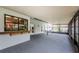 Inviting screened lanai with a pass-through window to the home's interior at 2609 Sunnyside Cir, Palm Harbor, FL 34684